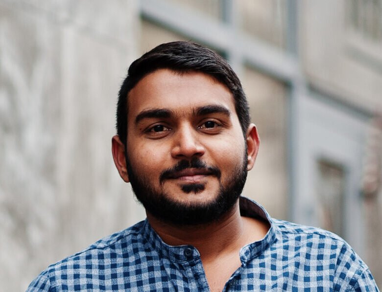 stylish indian beard model man in casual clothes posed outdoor a